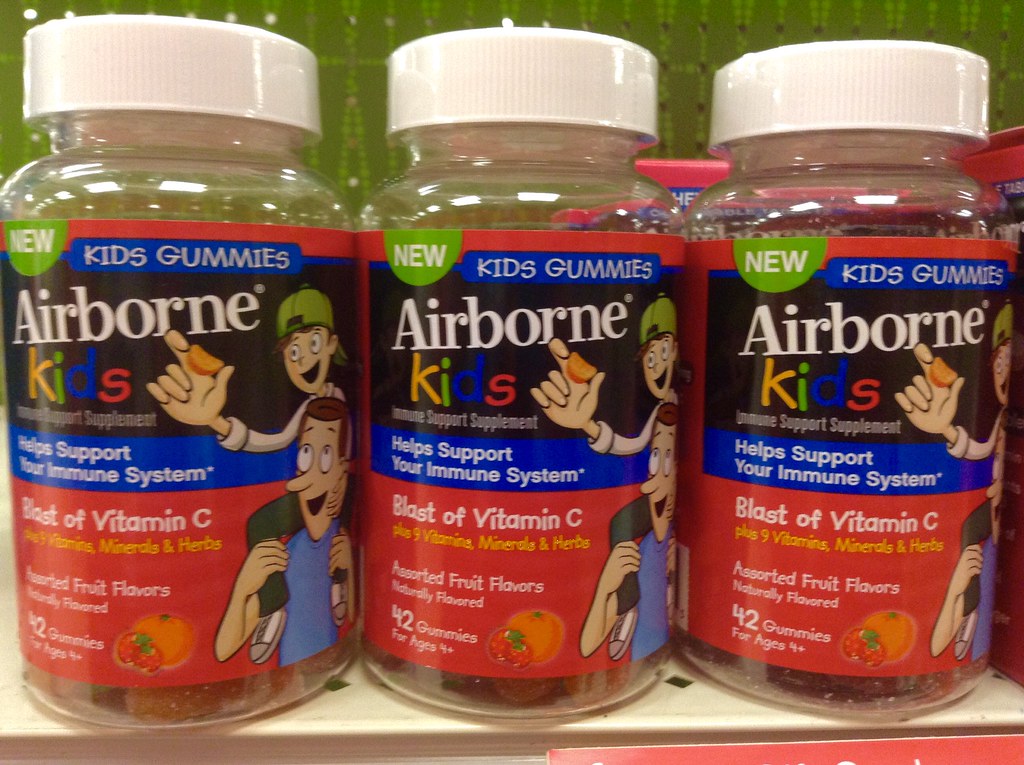 Elderberry syrup for colds in a glass bottle with a spoon, immune support routine