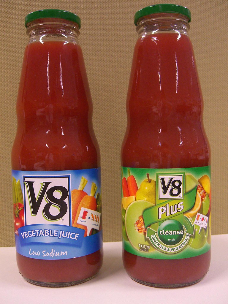 Assorted dietary fibre supplements UK in bottles and jars on a wooden surface