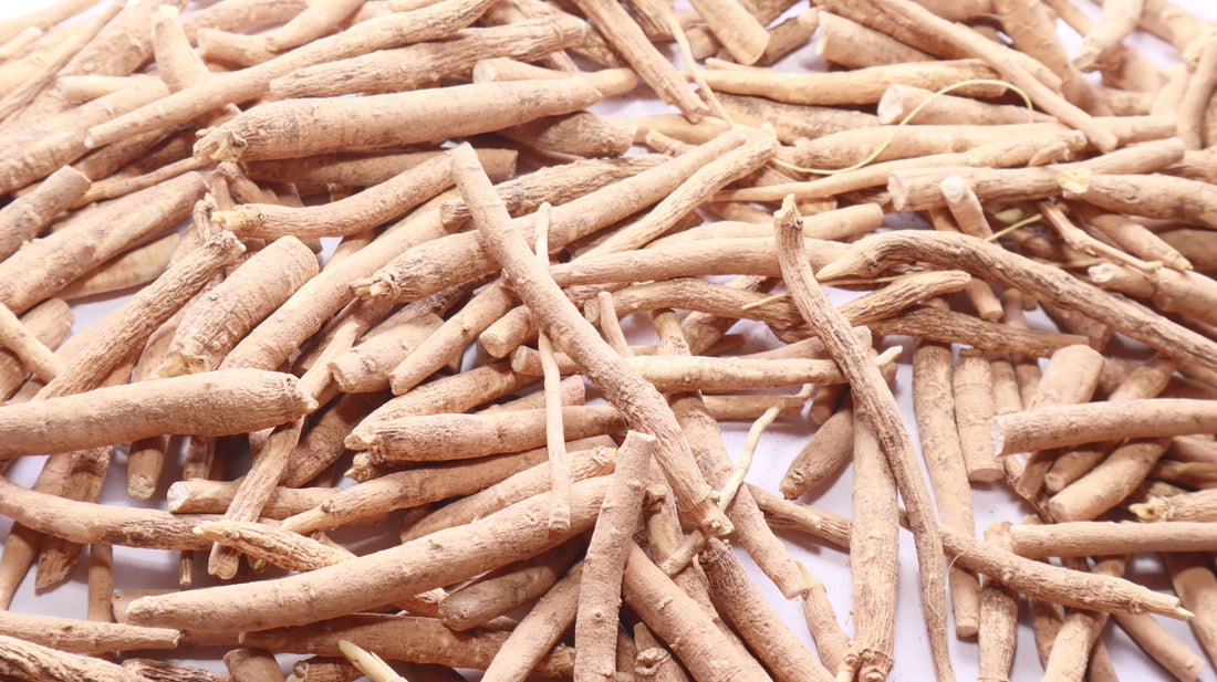 Ashwagandha root powder in a bowl with a wooden spoon, representing ashwagandha for stress and anxiety supplement