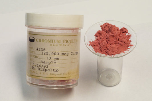 Bottle of chromium picolinate supplement for blood sugar support on a wooden table