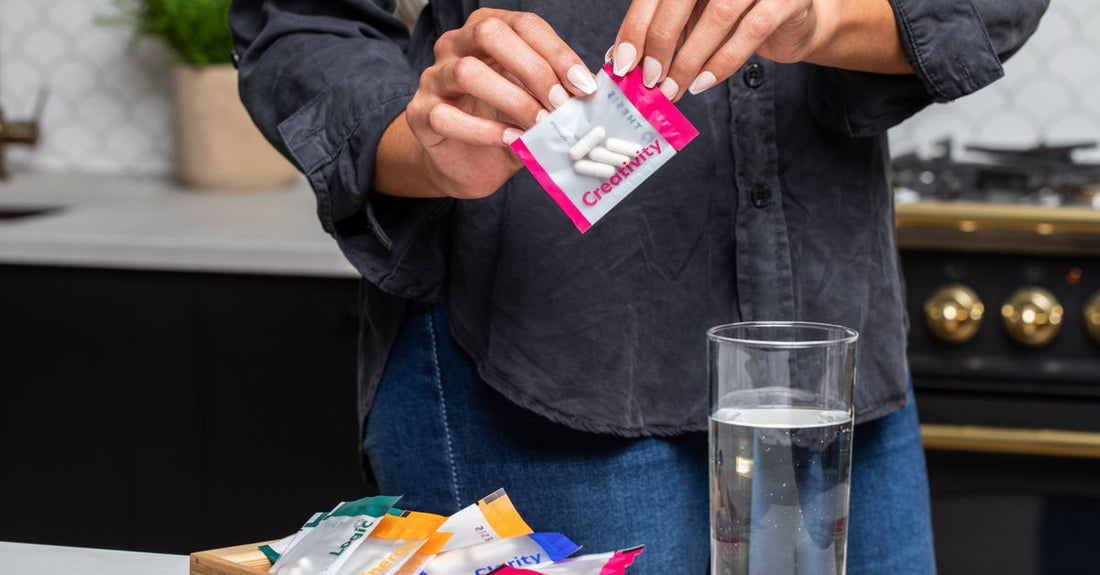 A flatlay of prebiotic supplement jars and capsules, representing a prebiotics buying guide UK for gut health.