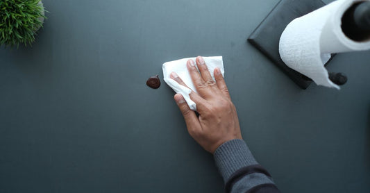 Flatlay of adhesive remover wipes and sprays on a clean white surface, ideal for best adhesive removers 2026
