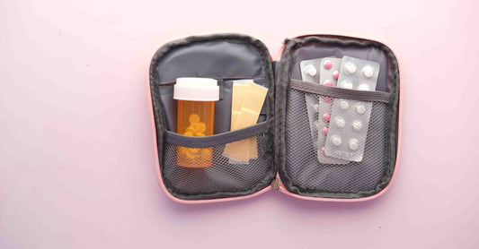 A budget-friendly first aid kit UK 2026 with essential supplies laid out on a neutral background.