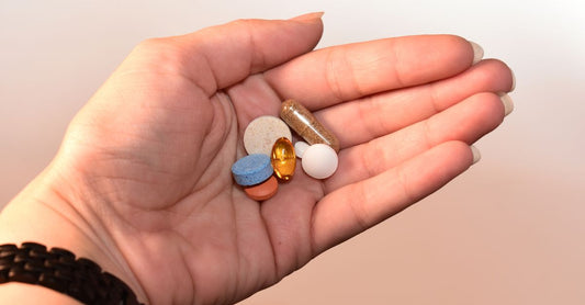 A cluster of glucosamine chondroitin MSM capsules on a clean white surface, representing UK joint health supplements.