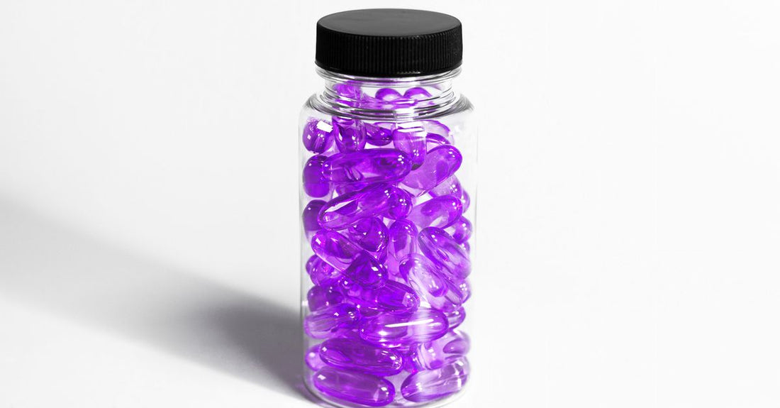 Black seed oil capsules in a dark glass bottle on a white background, showcasing black seed oil capsules UK supplement