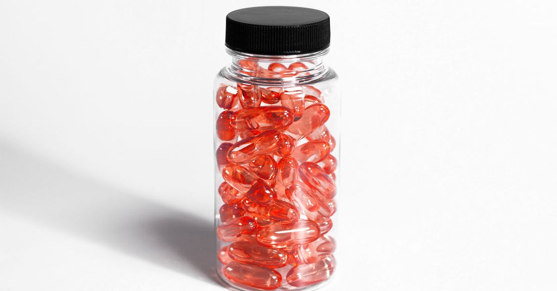 Cranberry supplements for UTI capsules in a glass jar on a white surface