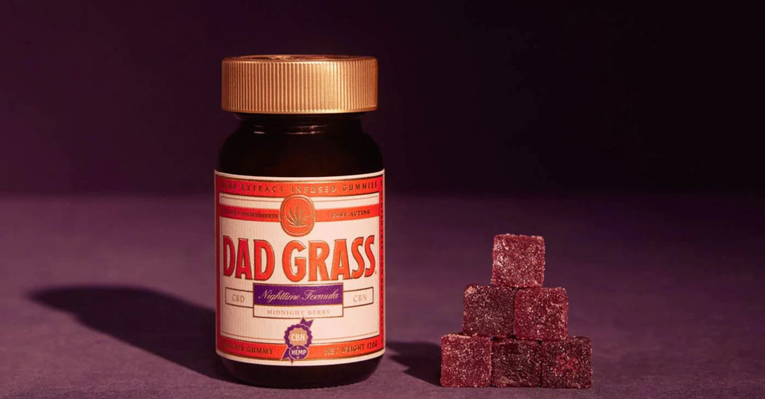 Bottle of biotin gummies for hair growth on a clean surface, showcasing the supplement shape and label.