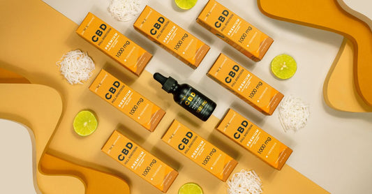 Flat lay of blended vitamin and mineral supplement bottles on a light wood surface, representing a UK buying guide for all-in-one formulas.