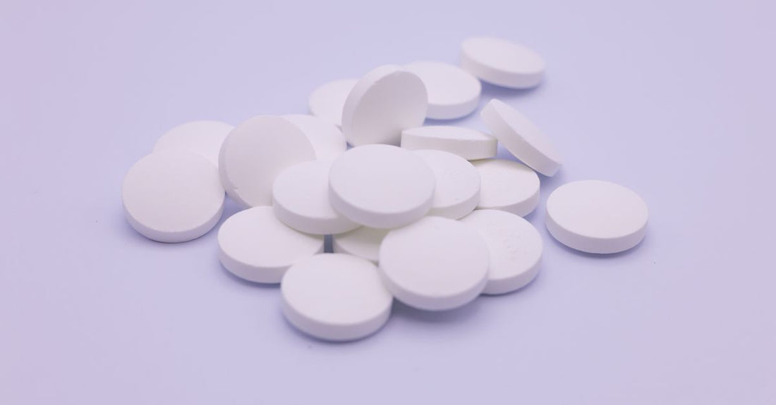 Best zinc UK 2026 supplement bottle on a clean white surface with softgels scattered around.