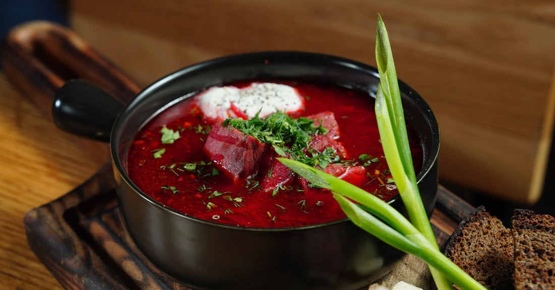 Nitric oxide boosters buying guide UK featuring a jar of beetroot powder on a kitchen counter.