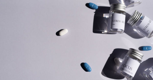 A white supplement bottle of dim supplement for acne placed on a clean surface.