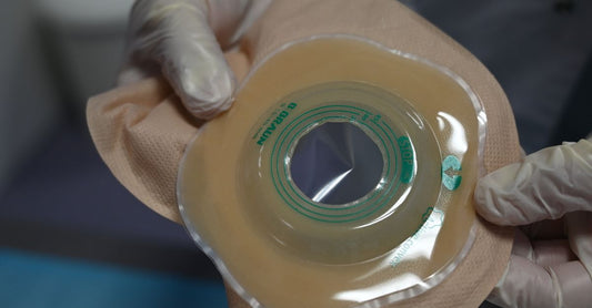 Various ostomy barrier rings and strips displayed on a clean surface, illustrating how to choose barrier rings & strips UK