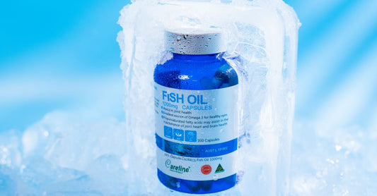 A glass bottle of clear fish oil softgels on a white background, illustrating a fish oil buying guide UK.