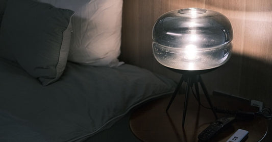 Compact sleep sound machine on a UK bedside table