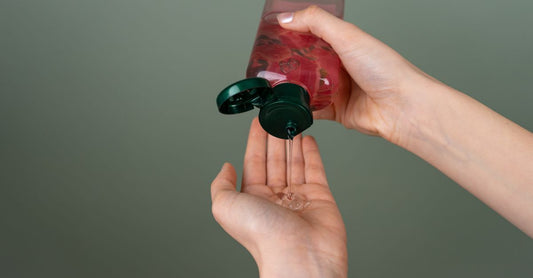 Hand sanitizer gel 70 alcohol bottle on a clean white surface