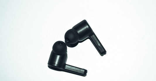 A selection of foam, silicone, and high-fidelity earplugs laid out on a surface, illustrating how to choose earplugs UK for different needs.
