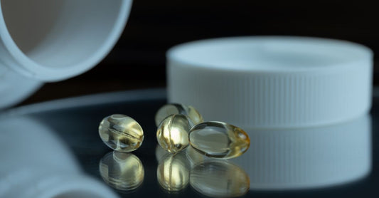 A bottle of calcium with vitamin D3 supplements on a clean surface, highlighting the importance of bone health support.