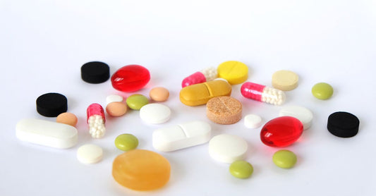 Selection of fat burner supplement capsules on a clean surface, representing best fat burners UK 2026.