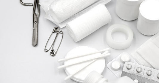 A roll of white hypoallergenic medical tape on a clean surface, ideal for sensitive skin wound care.
