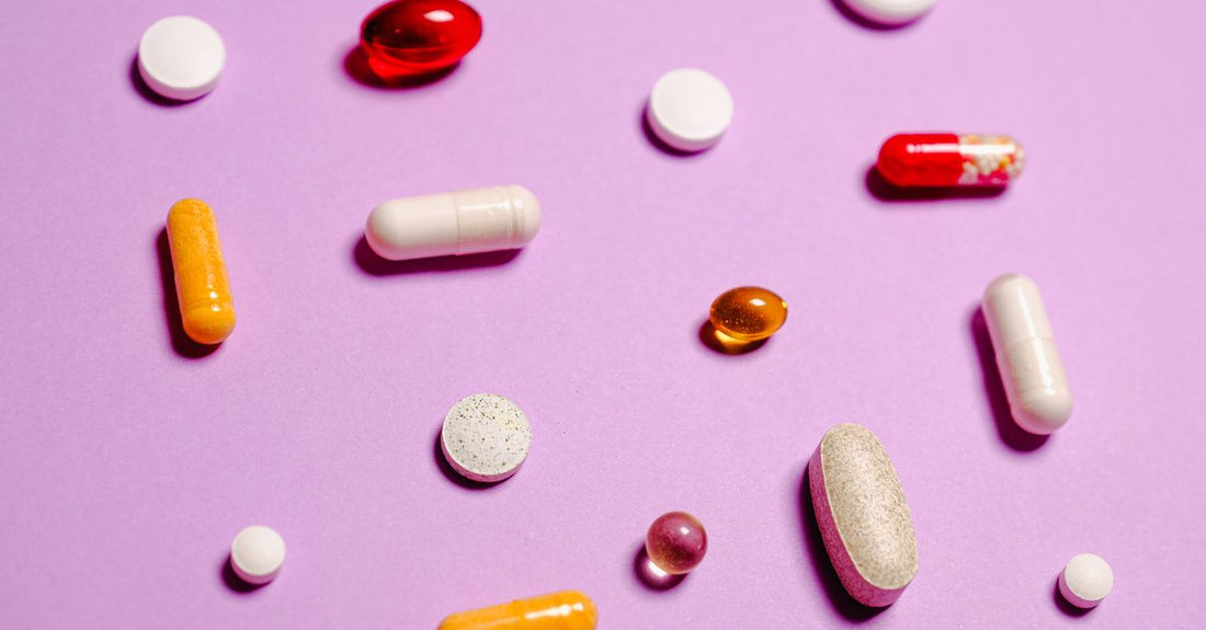 Multivitamin capsules in a glass jar on a clean surface, illustrating how to choose multivitamins UK.