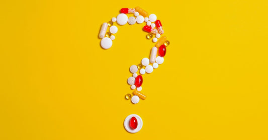 A bottle of vitamin A supplements on a white background, illustrating how to choose vitamin A UK products.