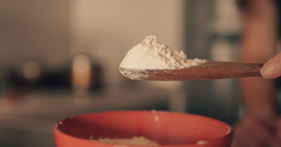 Best pre-workout UK 2026 powder scoop on dark surface