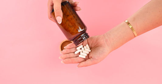 Bottle of l-lysine supplements for cold sore prevention on a clean surface.