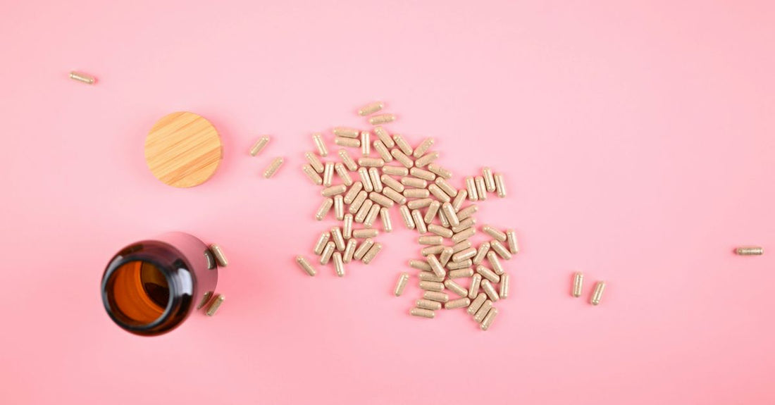 Probiotic capsules for IBS displayed on a clean white surface with a leaf motif, representing natural gut health support.