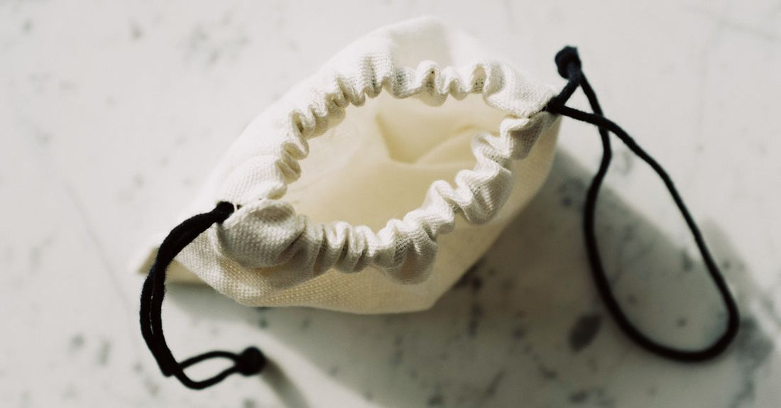 A selection of modern drain pouches and ostomy accessories arranged on a clean surface, illustrating options from a drain pouches buying guide UK.