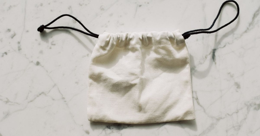 A selection of drain pouches and catheter bags arranged neatly on a clean surface, illustrating a drain pouches buying guide UK.