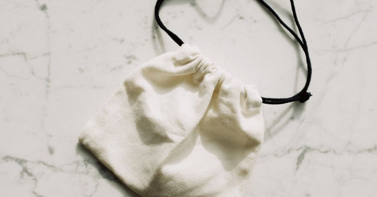 How to choose drain pouches UK: a flatlay of ostomy drain pouches and stoma care accessories on a clean surface.