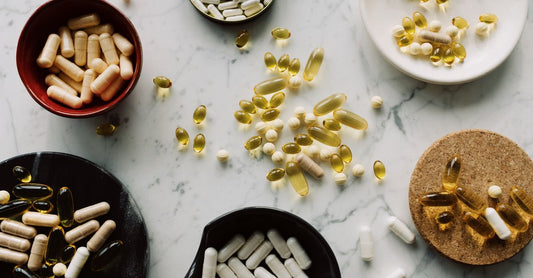Probiotic capsules and a supplement bottle on a clean surface, representing probiotics for women health science.
