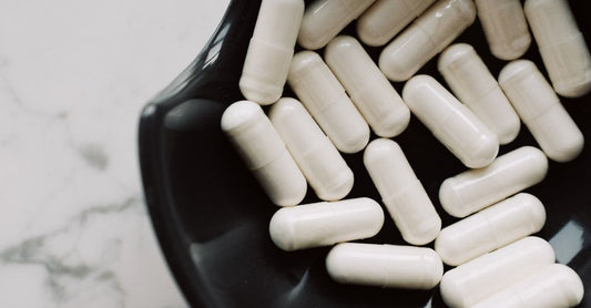 Bottles of best menopause UK 2026 supplements arranged on a clean surface for a flatlay product shot.
