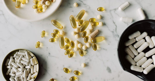 Vitamin D supplement bottle on a clean background, illustrating vitamin d deficiency symptoms and supplementation.