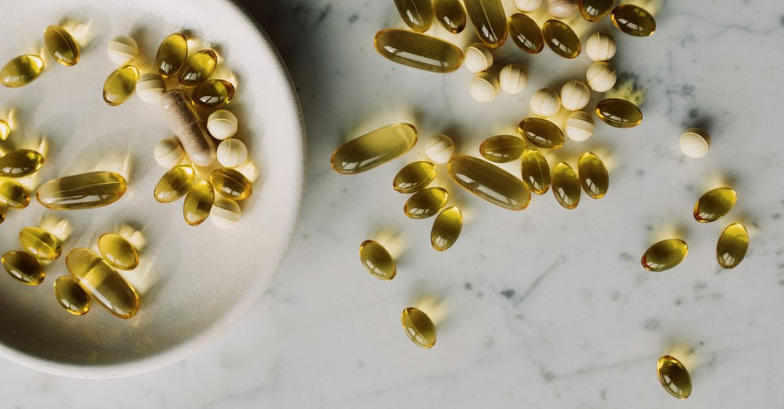 A small amber glass bottle of vitamin D3 & K2 combination softgels on a clean white background, with the Nutrisentra logo faintly visible, illustrating our vitamin D3 & K2 combinations buying guide UK.