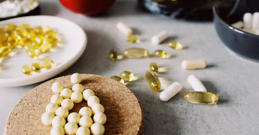Bottle of digestive enzymes for bloating on a white background, capsules visible.