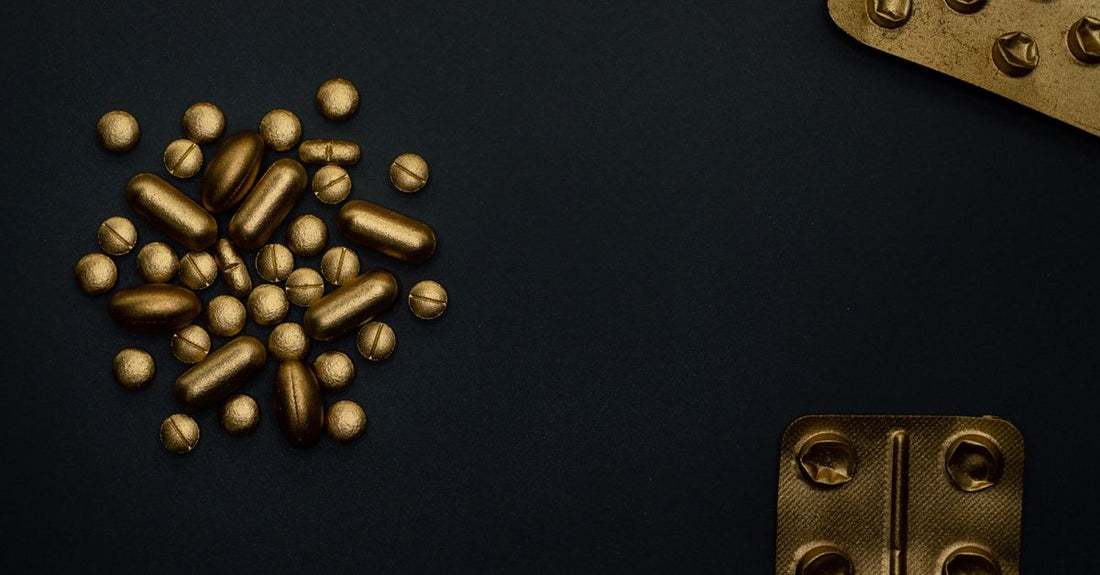 A bottle of best B9 (folic acid) UK 2026 supplements on a clean white surface with a few tablets scattered nearby