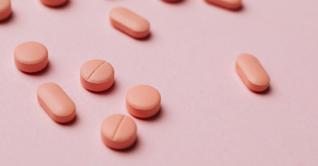 Vitamin B12 supplement bottles and tablets arranged on a clean surface, highlighting where to buy B12 online in the UK.