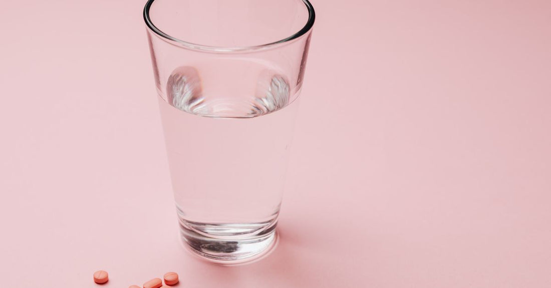 A probiotic supplement capsule on a glass surface, illustrating acidophilus probiotics benefits for digestive health.