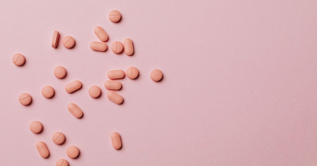 Vitamin A retinol supplements in a glass jar on a white surface, highlighting skin health benefits