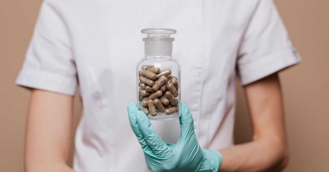 Bottle of saw palmetto for BPH prostate health supplement capsules on a clean white surface.