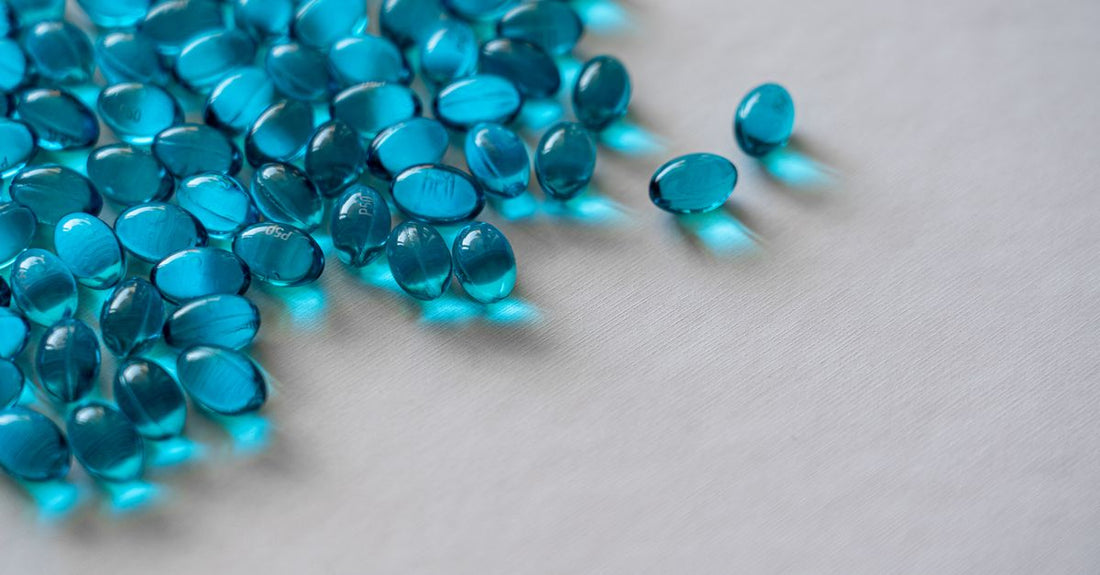 A selection of antioxidant supplement capsules and powders on a clean white surface, illustrating an antioxidants buying guide UK.