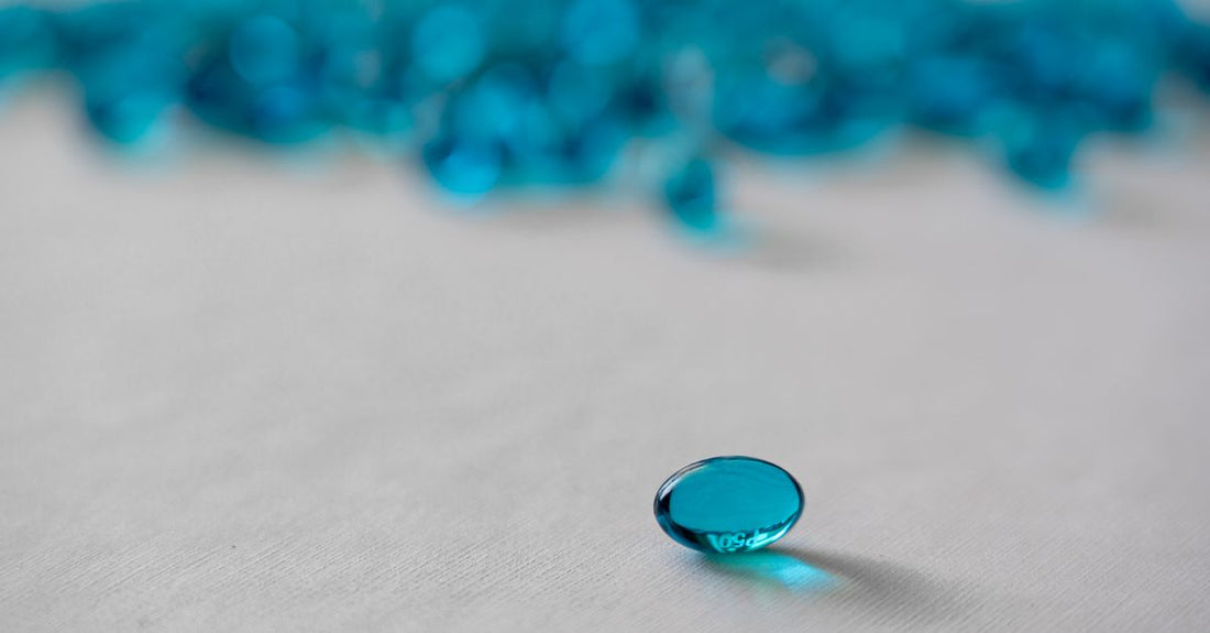 Chromium supplement capsules spilling from a brown glass bottle on a white background, illustrating a chromium buying guide UK