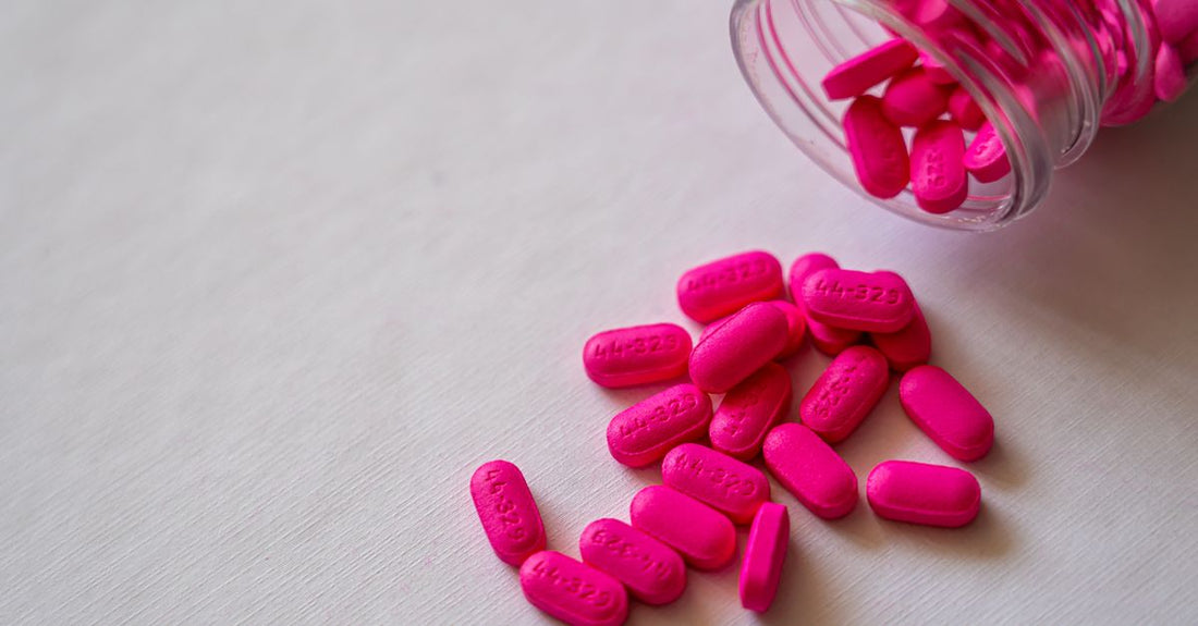 Assorted liver extract supplement capsules and tablets on a clean flatlay surface, illustrating how to choose liver extracts UK
