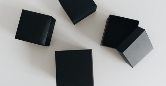 A selection of adhesive bandages in different shapes and materials laid out on a clean surface, illustrating options in an adhesive bandages buying guide.