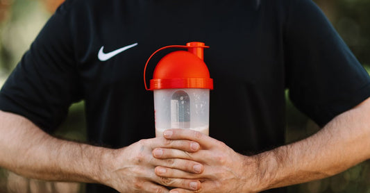A range of sports nutrition supplements including protein powder and energy gels on a clean white surface, representing the best diet & sports nutrition UK 2026.
