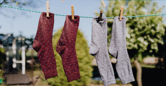 Compression socks for flight laid flat on a neutral background, showing graduated compression design and soft fabric.