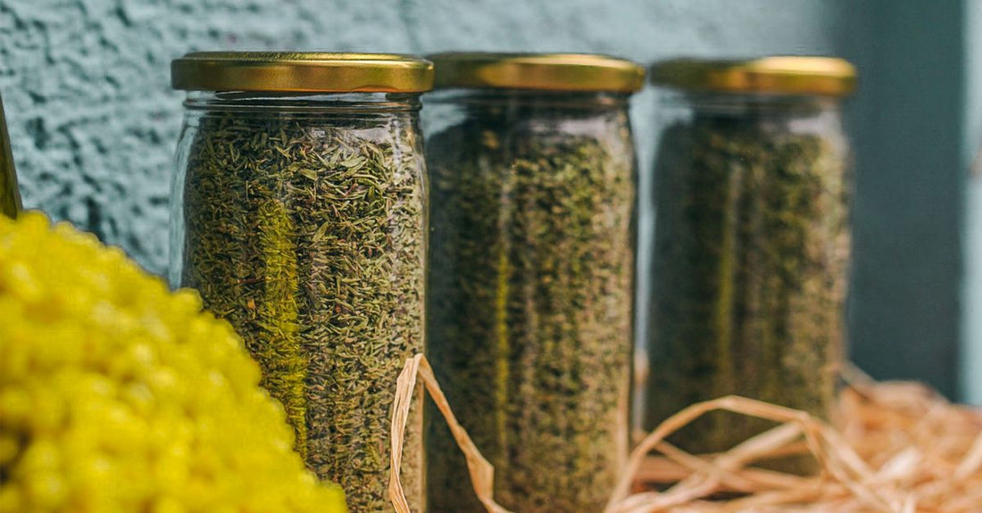 Organic psyllium husk in a clear glass jar with a wooden scoop, representing a psyllium buying guide UK for quality fibre supplements.