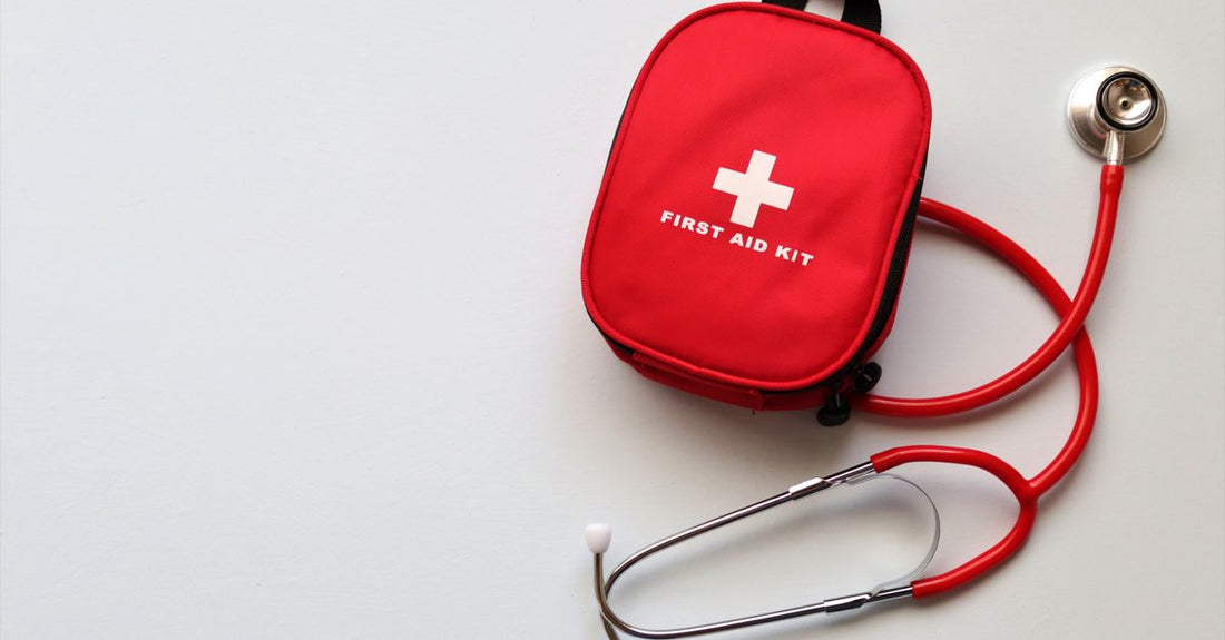 An open first aid kit displaying bandages, plasters, and antiseptic items, representing the best first aid UK 2026 options.