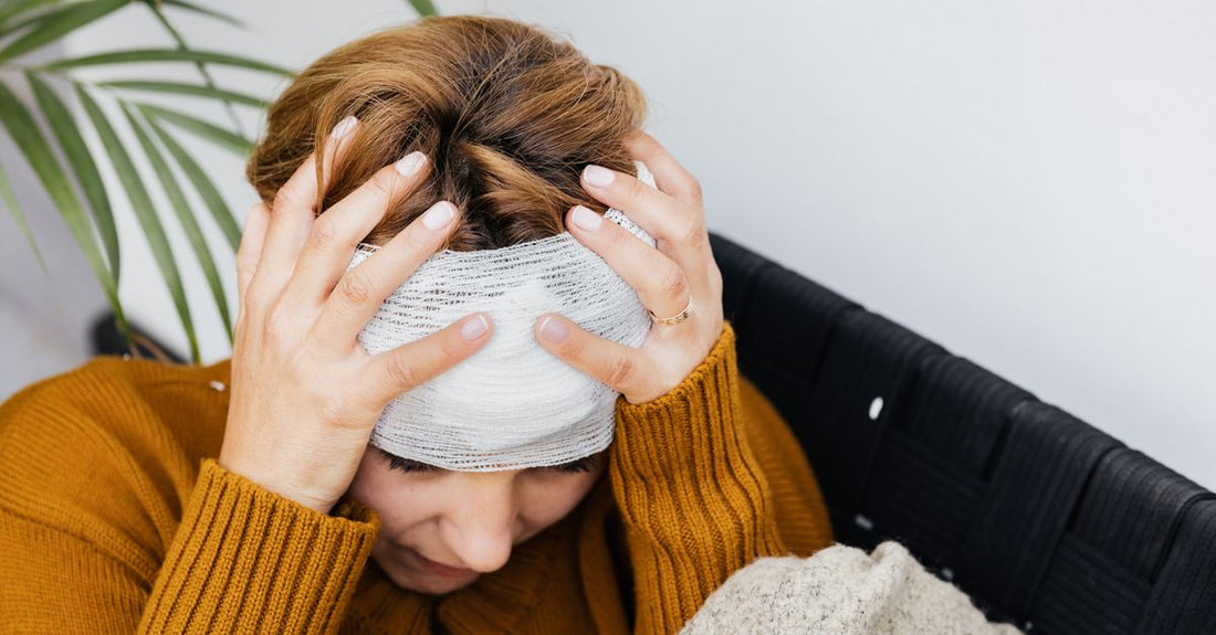 A flatlay of various adhesive bandages in different sizes and materials, showcasing breathable fabric and waterproof options for wound care.
